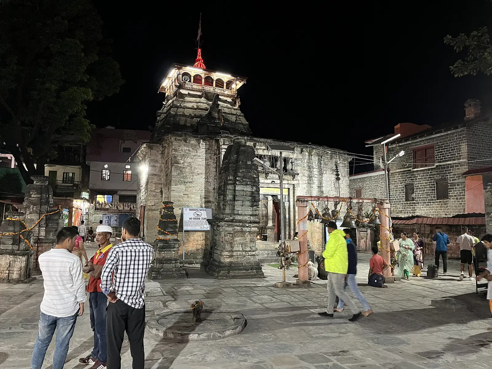 The Bagnath temple in Bageshwar, lit up at dusk.
