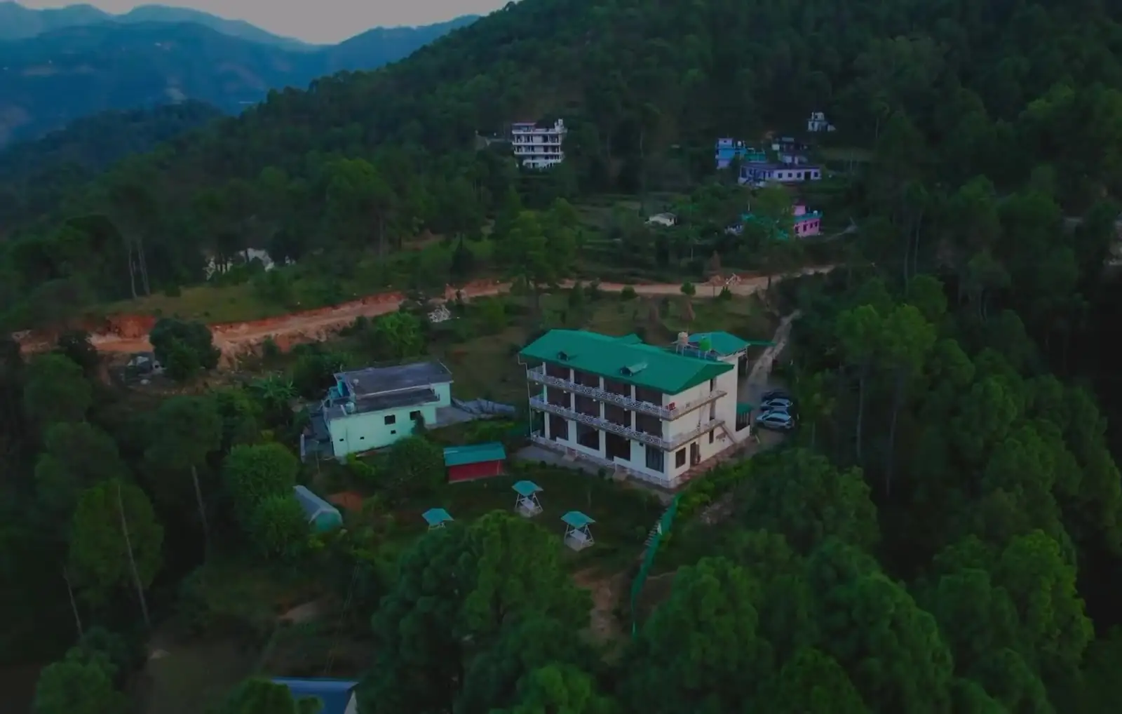 Aerial view of Lap of Himalayas resort in the pine forest of Kausani