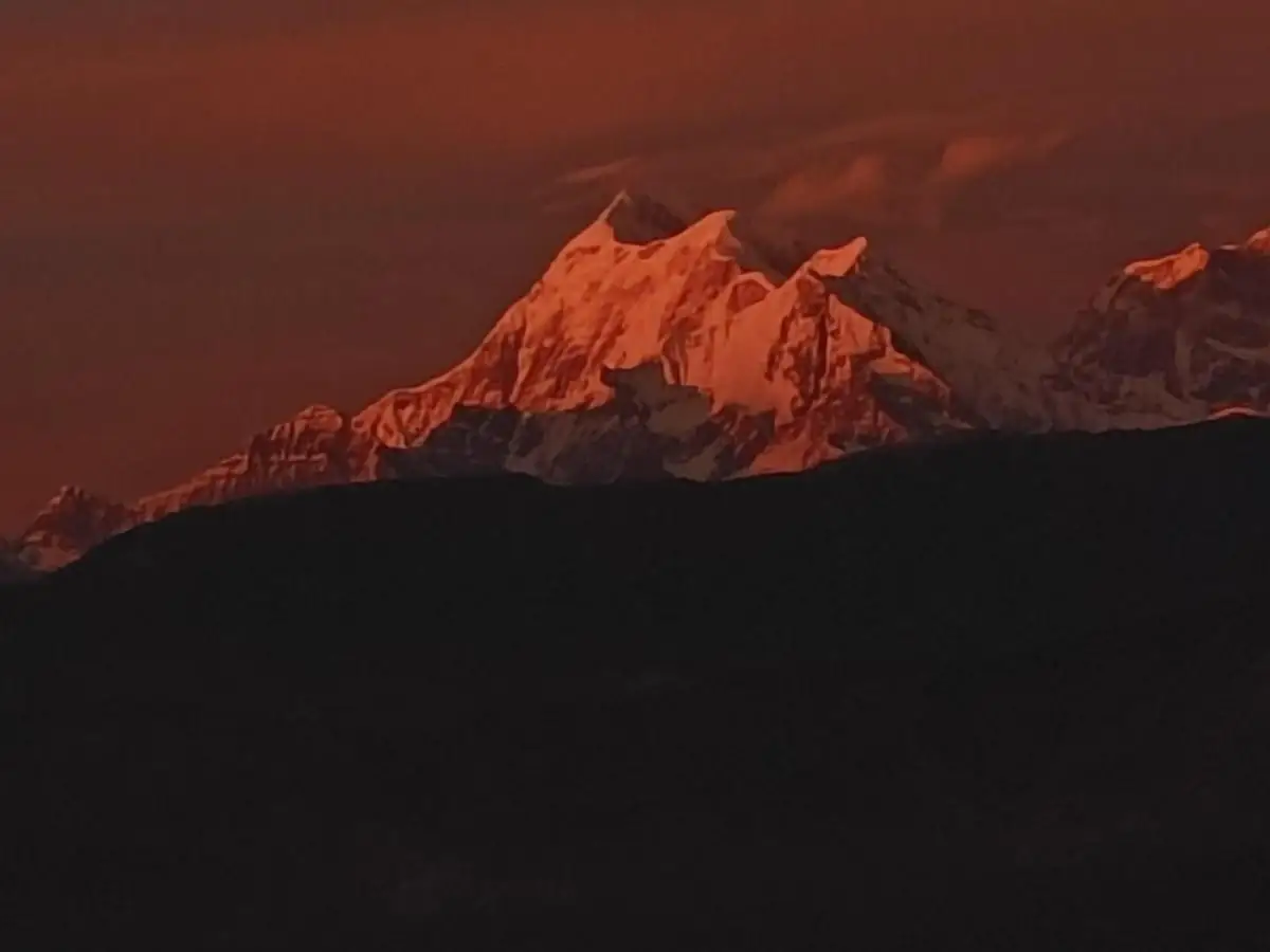 Sunrise lighting up the Himalayan peaks seen from Kausani